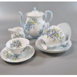 Shelley fine bone china 'Forget me Not' tea for two set comprising: teapot, two cups and saucers,