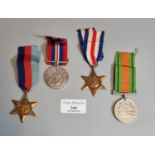 Four WWII medals, to include: 1939-45 War Medal, 1939-45 Star, France and Germany Star, and