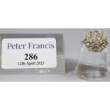 9ct gold cluster ring of white stones. Ring size N. Approx weight 4.6 grams. (B.P. 21% + VAT)