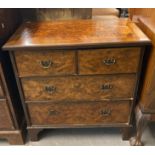 Early 20th century burr walnut straight front chest of two short and two long drawers on bracket