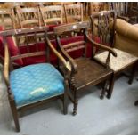 Two similar early 19th century oak elbow chairs, one with stick back one with ball and rail back,