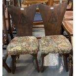 Pair of early 20th century hall chairs, the backs carved with maritime sextant, with shaped sides