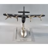 Modern metal aircraft desk ornament in the form of a four engine bomber on metal pedestal with