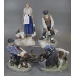 Three Royal Copenhagen porcelain figure groups, to include: 779, 772 and 627, of figures with cattle