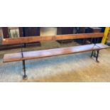 Early 20th century cast iron pitch pine school/platform bench with reversible back rest. (B.P. 21% +