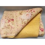Vintage cotton double sided Welsh quilt with leaf and swirl pattern, one side plain mustard colour