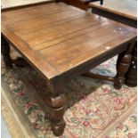 Early 20th century oak draw leaf kitchen table on baluster turned legs and X frame support. (B.P.