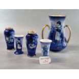 Collection of Royal Doulton blue and white printed vases of varying forms, some in pairs, one with