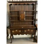 18th century style oak two stage dresser, the moulded cornice above a shaped frieze, boarded rack