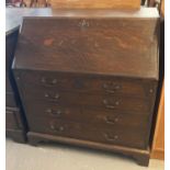 Early 20th century oak fall front bureau with plaque marked Designed and Executed by Bartholomew &