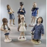 Six Royal Copenhagen porcelain figurines of young children, one with kittens. Varying shape numbers.