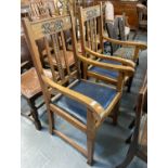 Pair of pale oak Arts and Crafts design slat back carver chairs on square tapering legs and spade