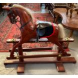 Modern child's rocking horse standing on a stained swing frame. (B.P. 21% + VAT)