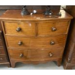 Victorian mahogany bow front chest of two short and two long drawers with turned handles. (B.P.