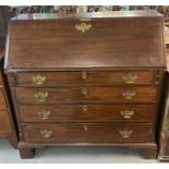 Late 18th century mahogany fall front bureau, the interior revealing fitted compartments above a