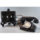 Vintage black GPO telephone on stand with braided cord, appearing to have been converted for