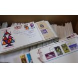 Jersey collection of First Day covers in large box. Commemoratives and definitives, mostly three