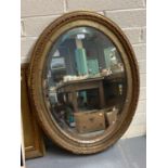 20th century oval gilt framed mirror. 87x65cm approx. (B.P. 21% + VAT)