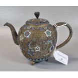 Small yellow metal bullet shaped teapot, overall with polychrome champleve enamel floral designs