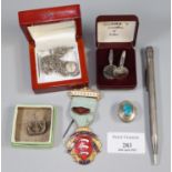 Plastic box comprising silver cufflinks, sterling silver life long pencil, silver pill box, silver