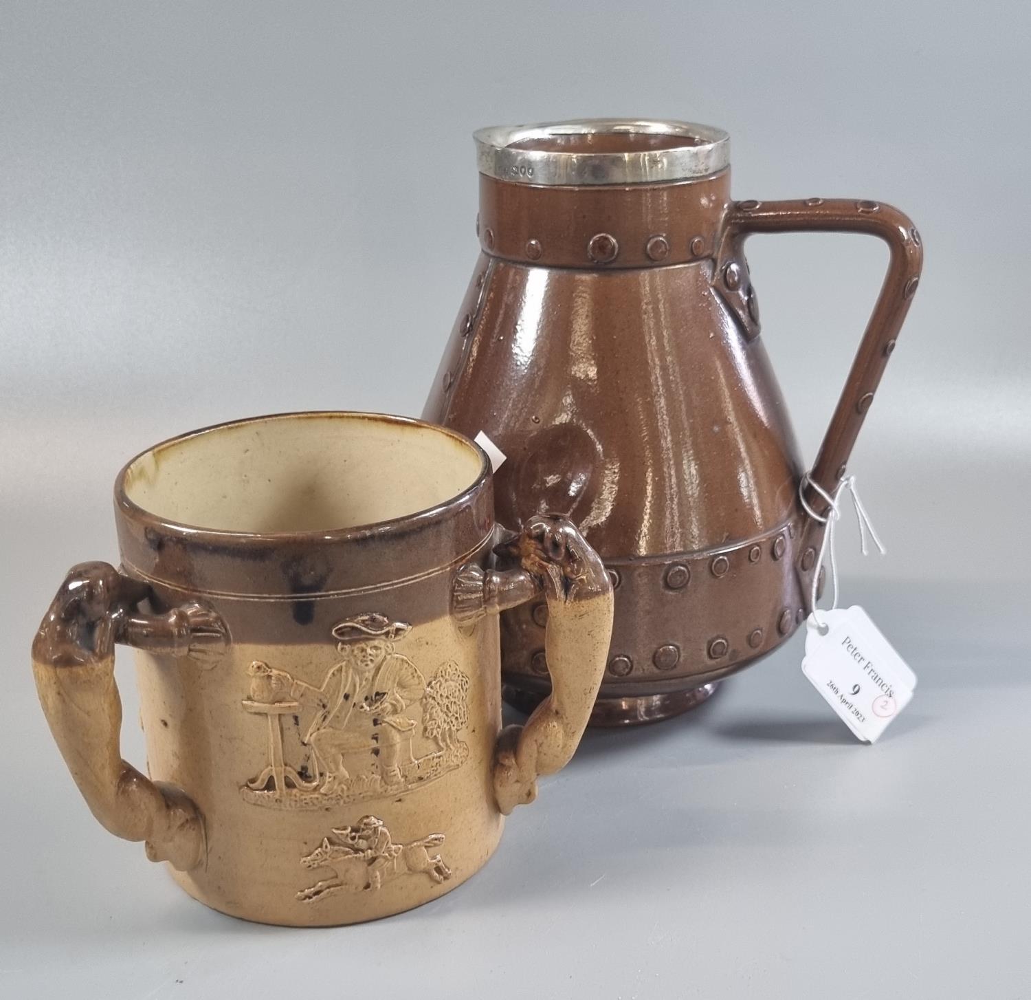 Doulton Lambeth Silicon 9037 ceramic jug in the form of a leather flagon with silver collar,
