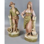 Pair of Royal Dux porcelain figures/spill vases, shape no. 2476 and 2477, modelled as a boy with
