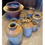 Collection of stoneware items, to include: flagons, utensil jars, mainly appearing unmarked together