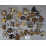 Collection of British military cap badges, various and assorted to include: East Anglia Regiment,