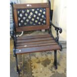 Modern cast iron framed garden armchair, the back with lattice design on a slatted seat. (B.P. 21% +