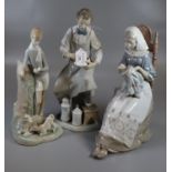 Three Lladro Spanish porcelain figurines to include: 19th Century chemist, girl with book and
