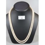 A double row cultured pearl necklace with 9ct gold pearl set clasp. Length 25 inches. (B.P. 21% +