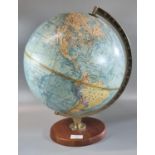 Phillip's stereo-relief table globe on wooden circular stand. (B.P. 21% + VAT)