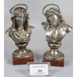 Two white metal busts of Mary and Jesus on red veined marble bases. (B.P. 21% + VAT)