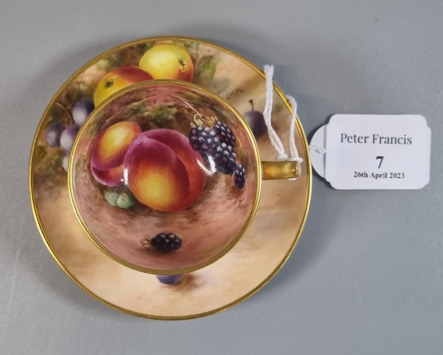 Royal Worcester porcelain demi-tasse hand painted with fruit, the cup with gilt exterior, signed