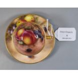 Royal Worcester porcelain demi-tasse hand painted with fruit, the cup with gilt exterior, signed