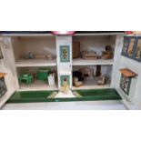 Mid century doll's house in Georgian style, the interior revealing assorted various furnishing