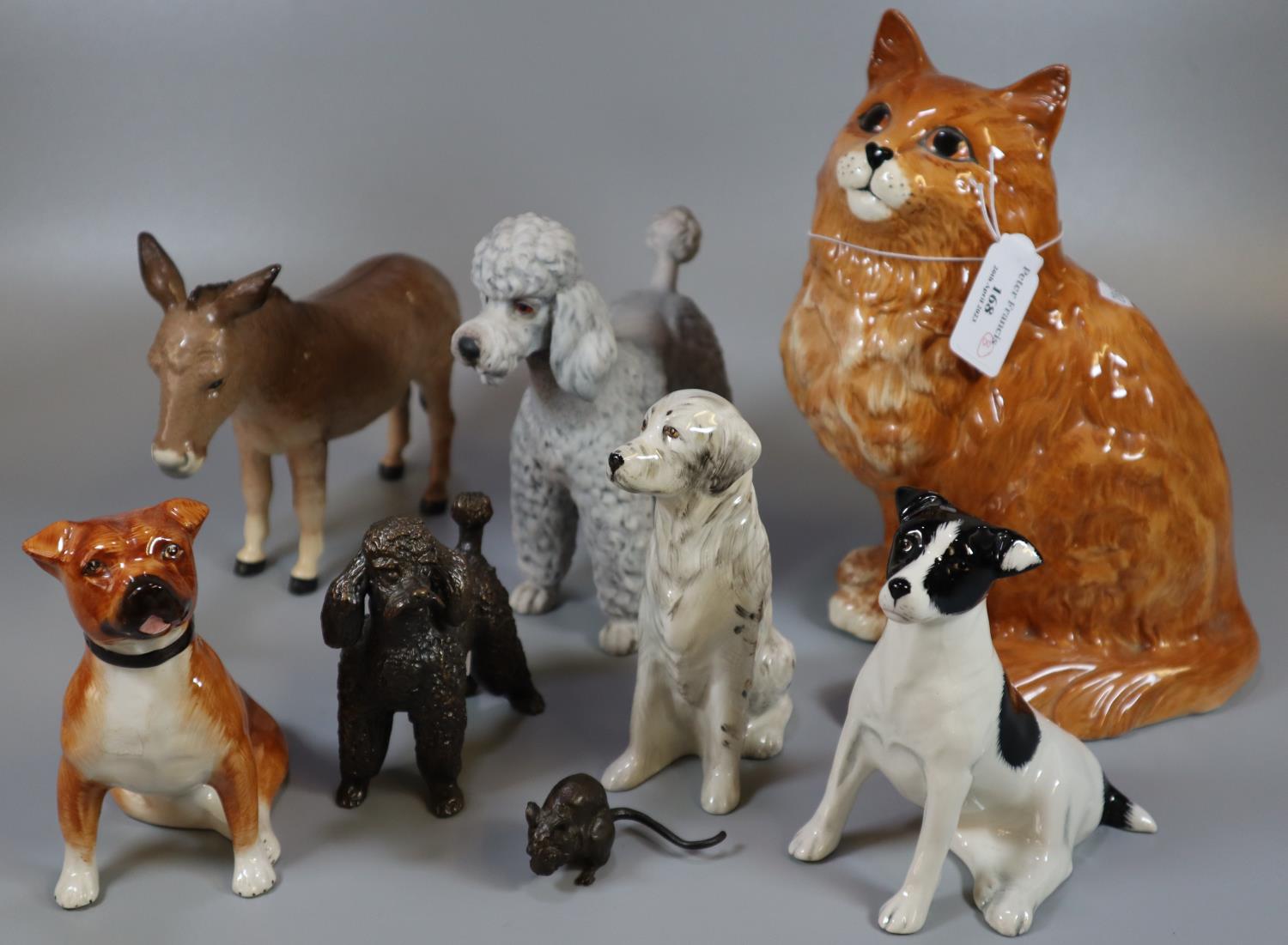 Collection of china animals to include: Beswick 1867 seated cat, Beswick donkey, poodles and other