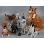 Collection of china animals to include: Beswick 1867 seated cat, Beswick donkey, poodles and other