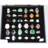36 cased and hallmarked 925 silver rings with cabochon and other hard and coloured stones. (B.P. 21%