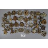 Selection of assorted British military cap badges including: Northamptonshire, Northamptonshire