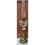 Early 20th Century double oil burner lamp, having clear glass chimney above a clear glass
