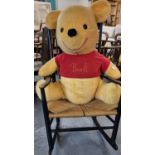 Large Winnie the Poo teddy bear with label marked Walt Disney Characters Manufactured by