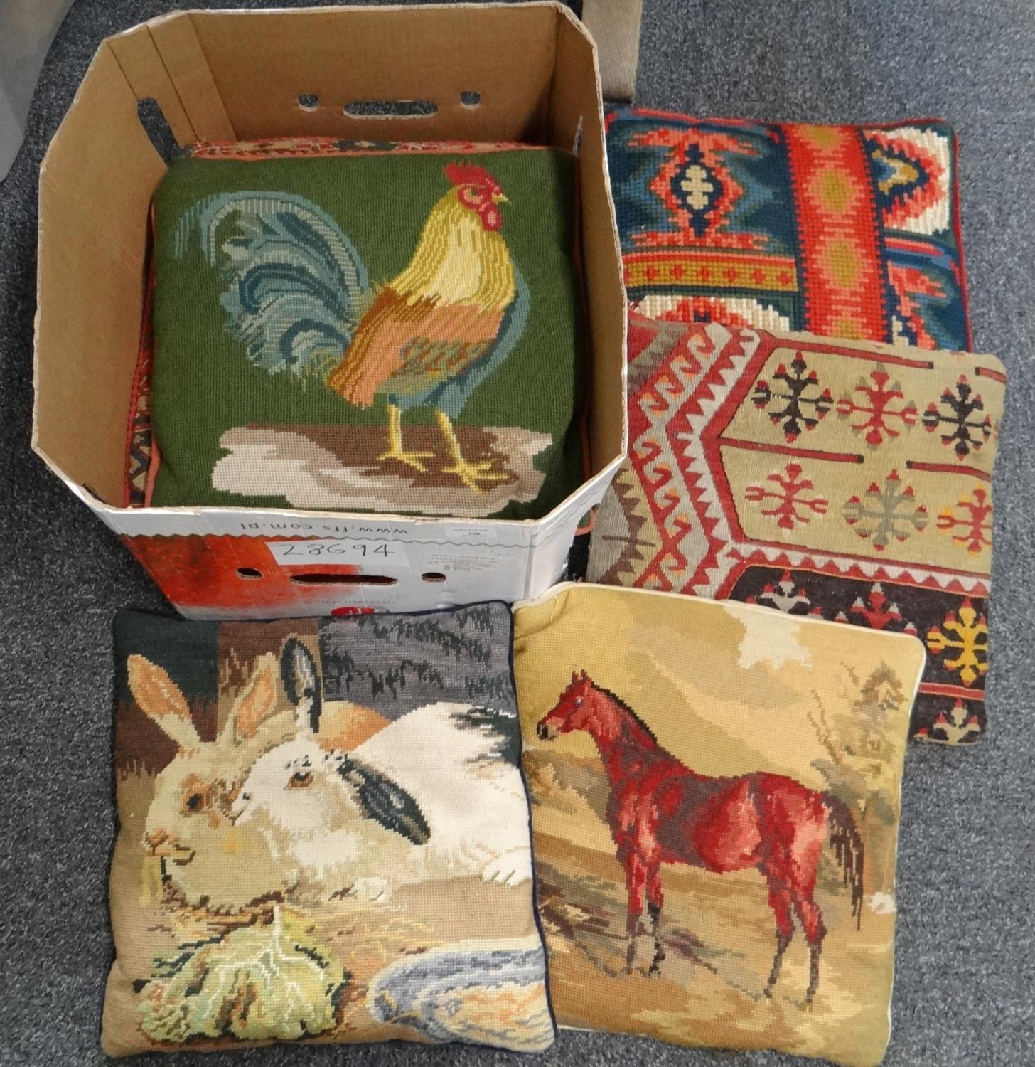Box of woollen needlepoint and fabric cushions to include; animal designs, carpet cushions etc. (
