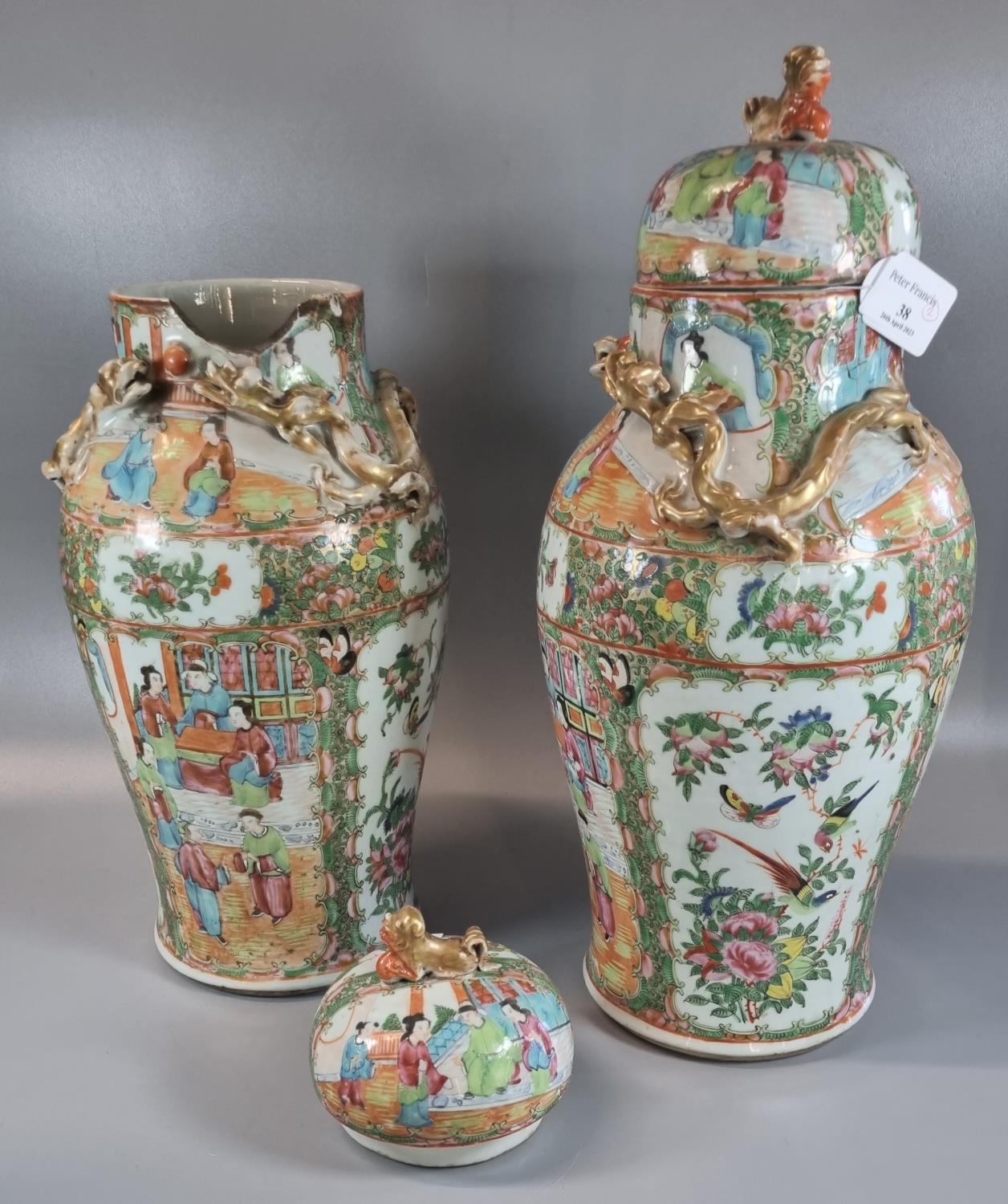 Pair of Canton famille rose baluster vases and covers, decorated all over with panels of figures