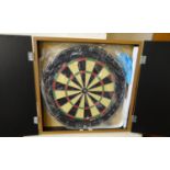 Modern unused Winmau darts board in fitted case for mounting on a wall. (B.P. 21% + VAT)