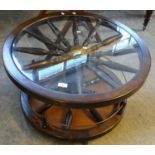 Modern novelty oak revolving coffee/drinks table with glass top in the form of a ships wheel. (B.