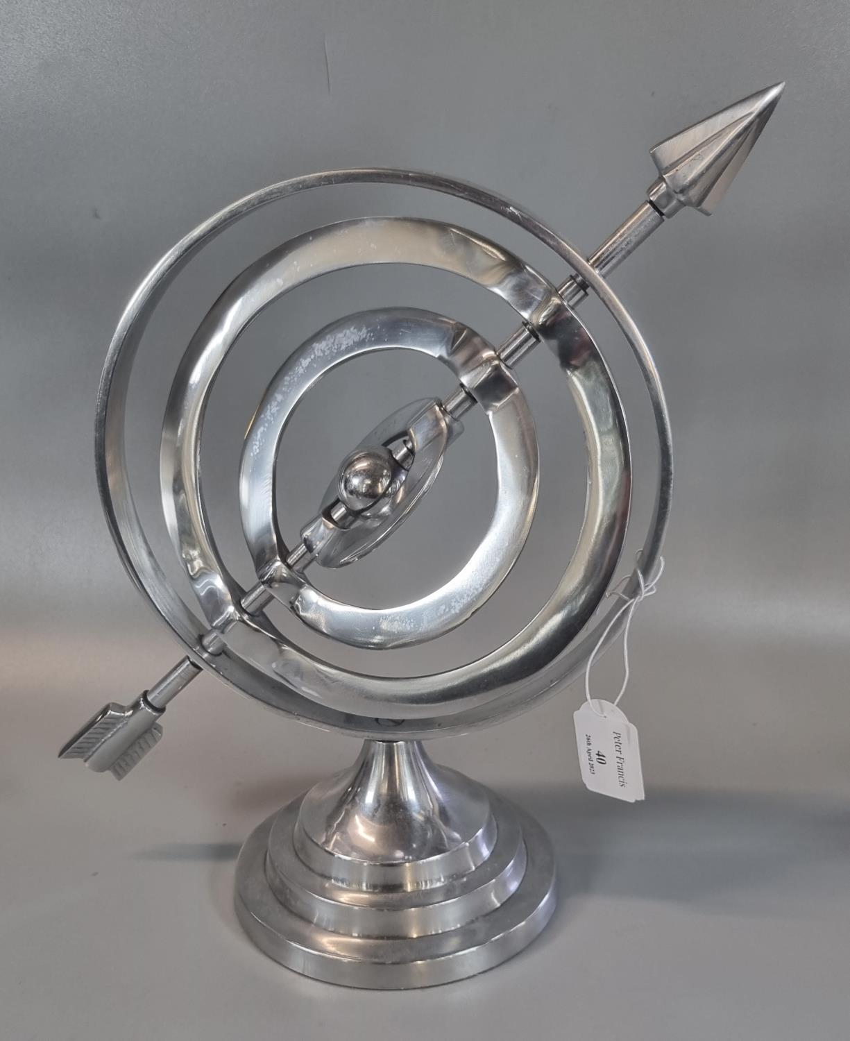 Modern chrome finish armillary globe on circular stepped stand. (B.P. 21% + VAT)