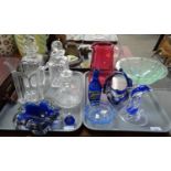 Two trays of glassware to include: green glass pedestal bowl with metal base, dolphin ornament,
