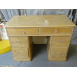 Late Victorian pine kneehole desk with glass knob handles. (B.P. 21% + VAT)