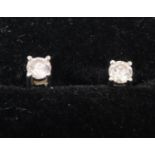 Pair of 9ct white gold diamond stud earrings. (B.P. 21% + VAT)